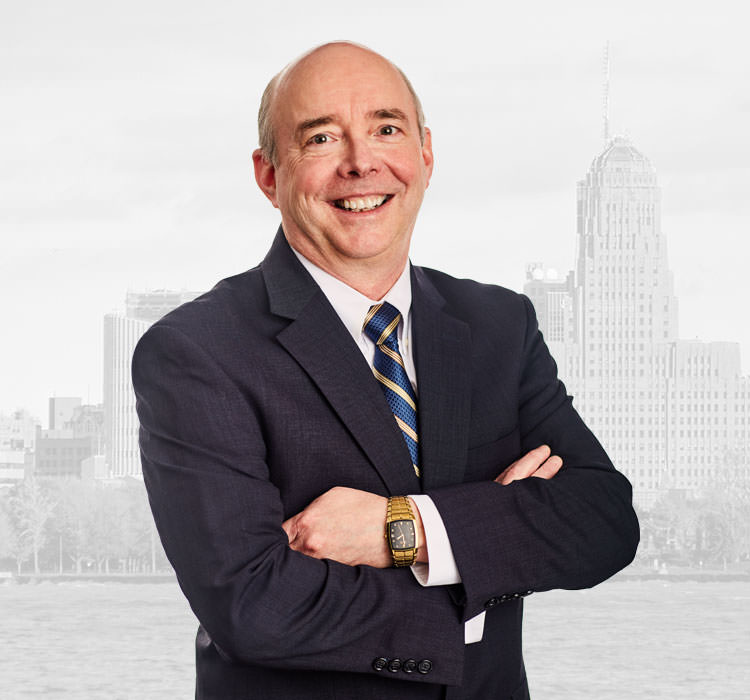 image of Thomas R. Emmerling standing with his arms crossed