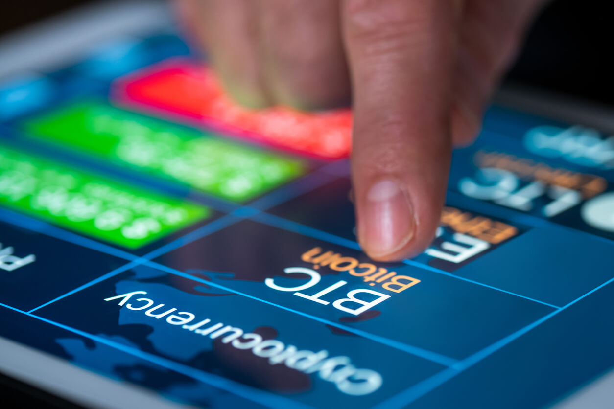 Close up shot of male hand and digital tablet with stock market graph